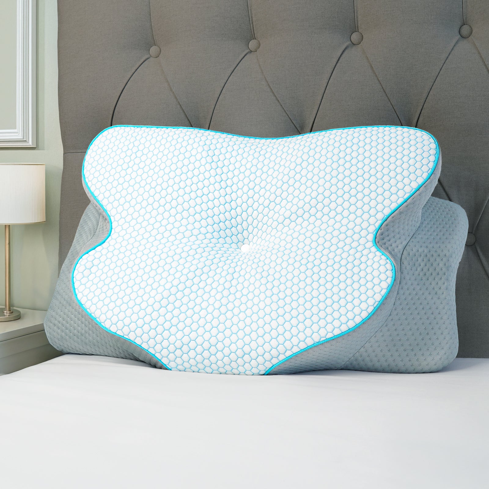 Atlas orthopaedic neck support pillow ergonomic butterfly design on a bed